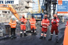 Team members listen to the safety talk